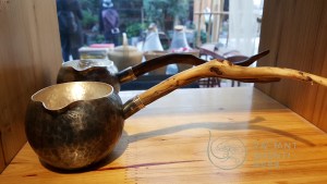 Hand crafted metal and wood tea tool